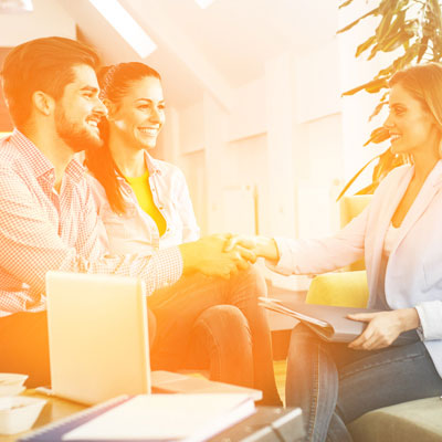 Young couple meeting with estate agent