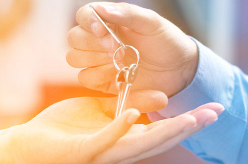 Keys being handed to new home owners